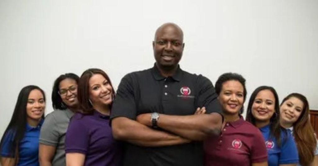 Emmanuel Osuyah and the Alpha Direct Agency team