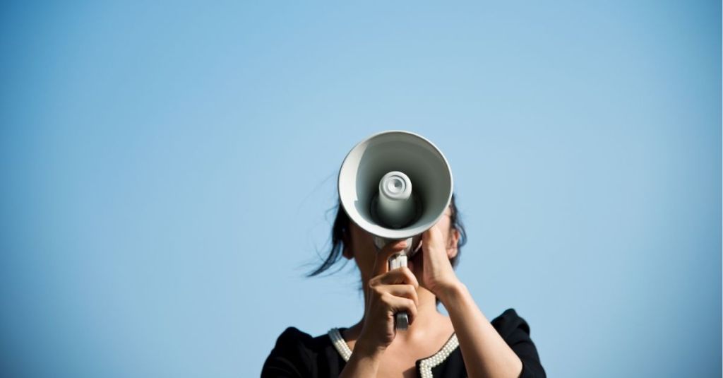 Woman speaking into megaphone