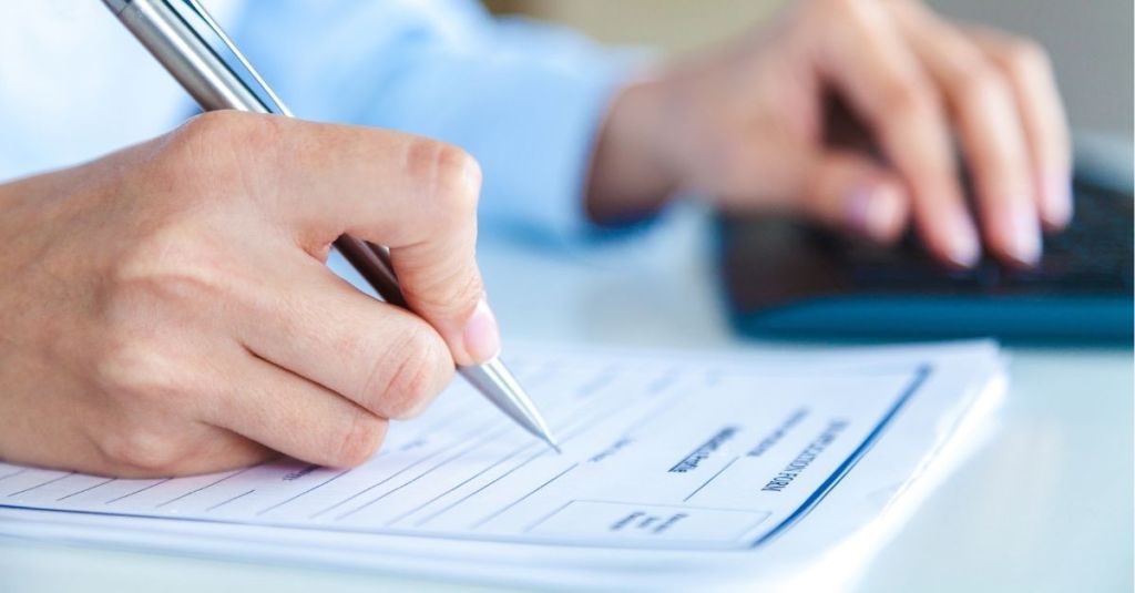 Person filling out application form