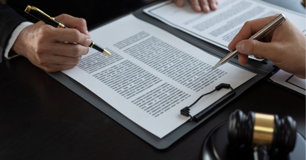 Two people discussing a document