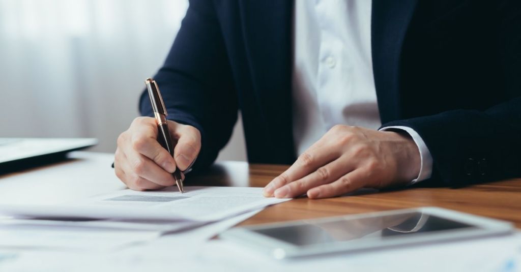 Man writing on a piece of paper