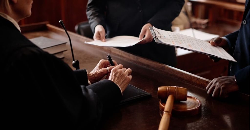 Lawyers speaking to the judge in a courtroom
