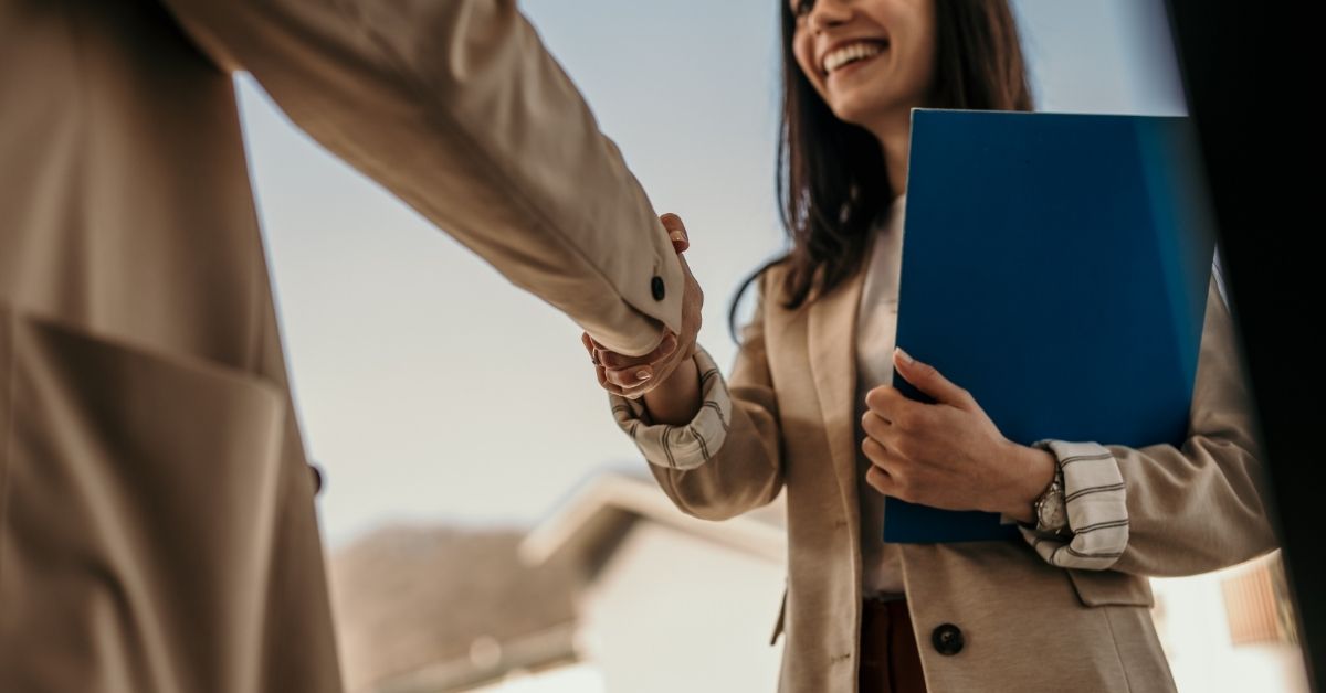 Person pointing at laptop screen