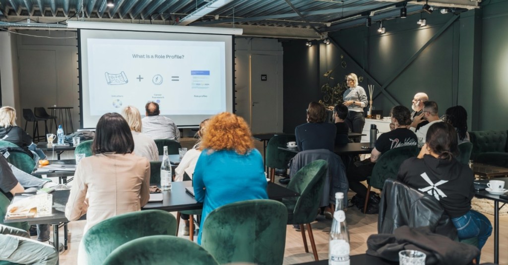 Woman instructing a crowd of people