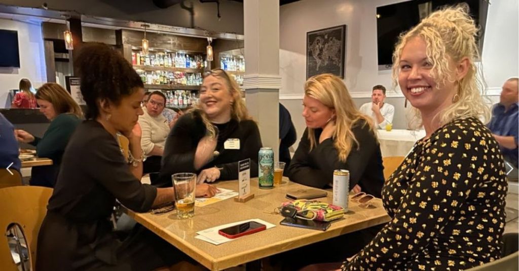 NextGen CNY members sitting at a table at CE Trivia