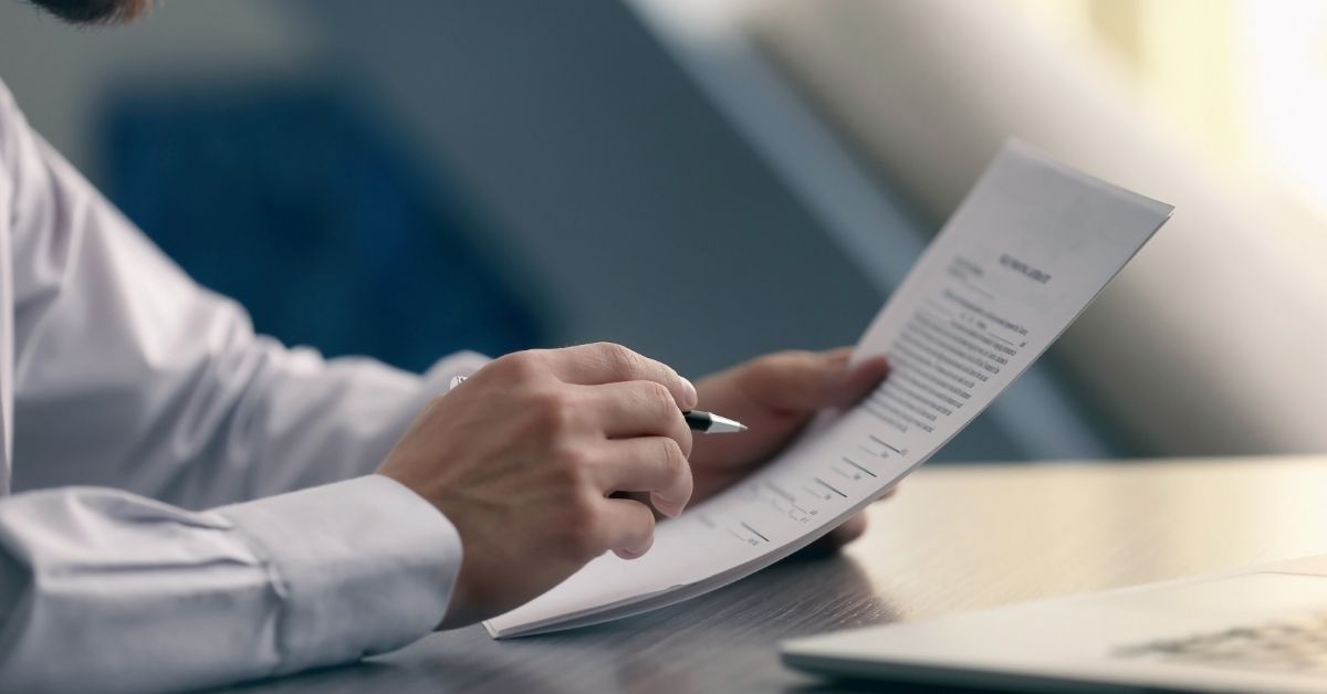 Woman signing document