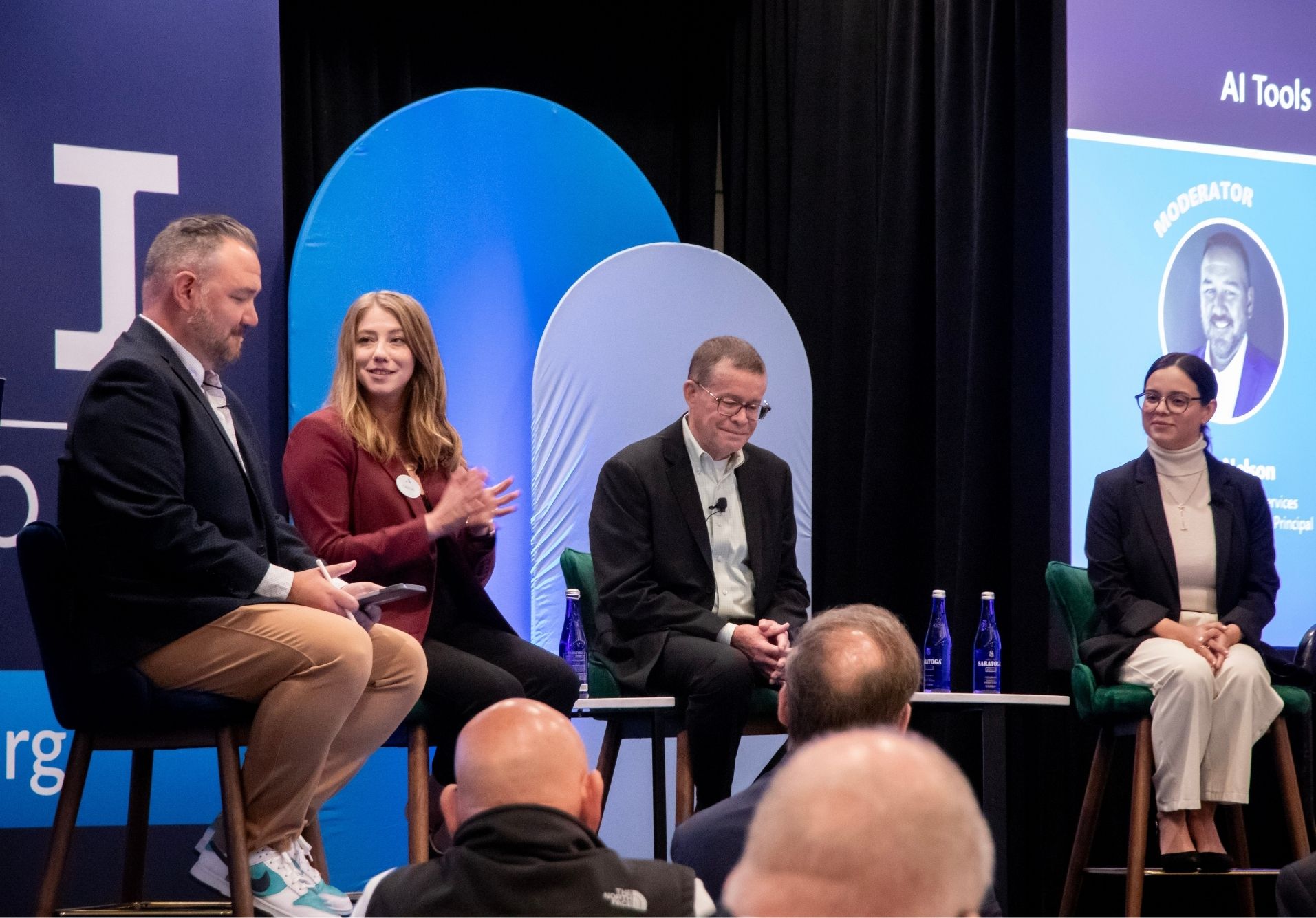 Stage view of panelists at Go Big 2025