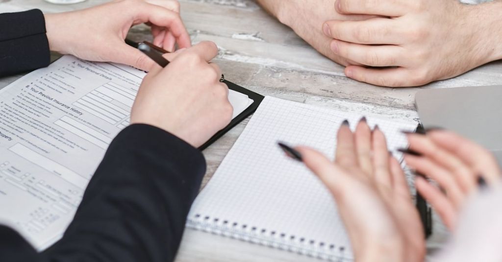 Three people having a meeting