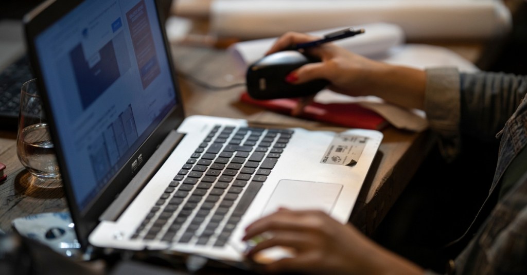 A woman working on a laptop