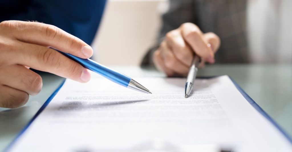 Two people reviewing a document