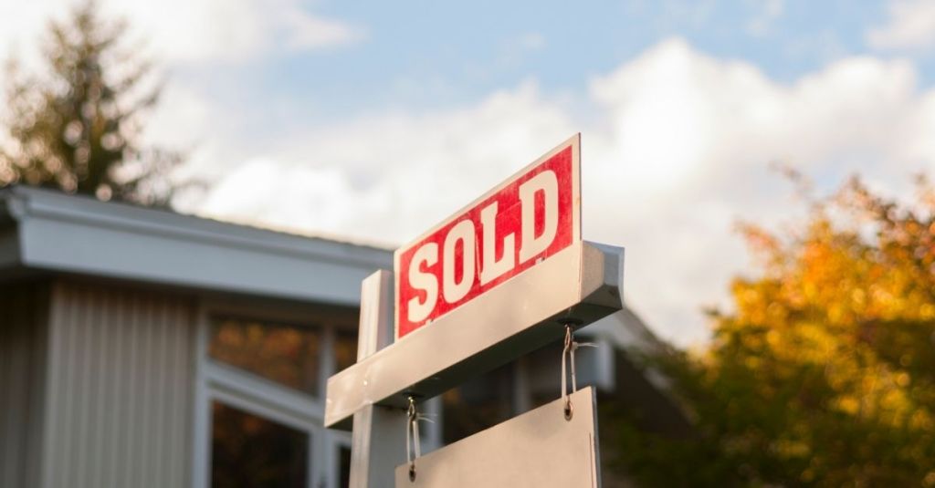 Sold sign in front of a house