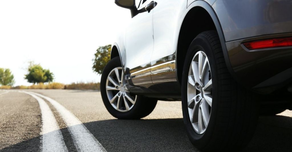 Worm's eye view of a car angled at its tires