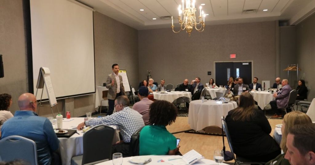 Travis Wattie speaking at the Local Leaders Summit 2025