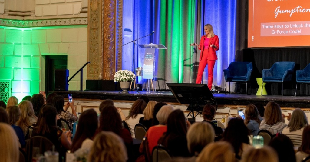 Tinsley English speaking on stage at the Women in Insurance Summit 2025