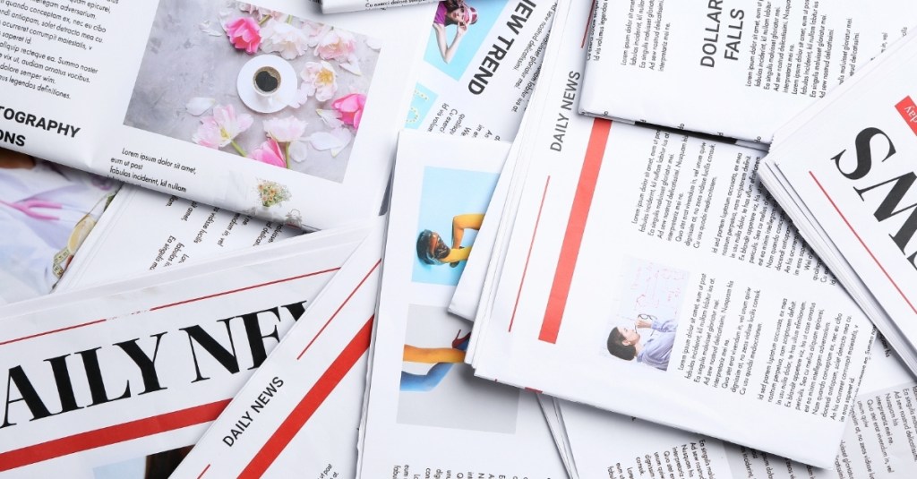 Top view of many newspapers scattered randomly