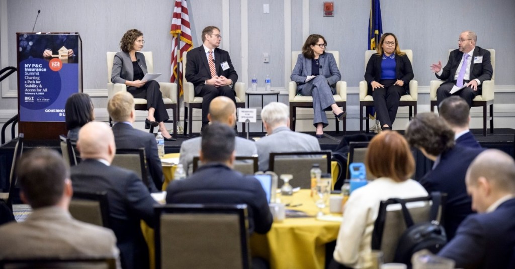 The view from the crowd of the panelists at the City & State P&C Insurance Summit 2025.
