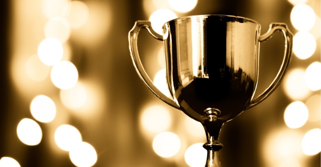 Gold trophy with bokeh lights in the background