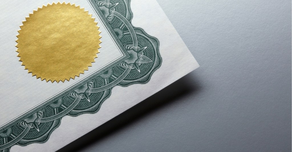 A close-up view of a foil sticker on a certificate
