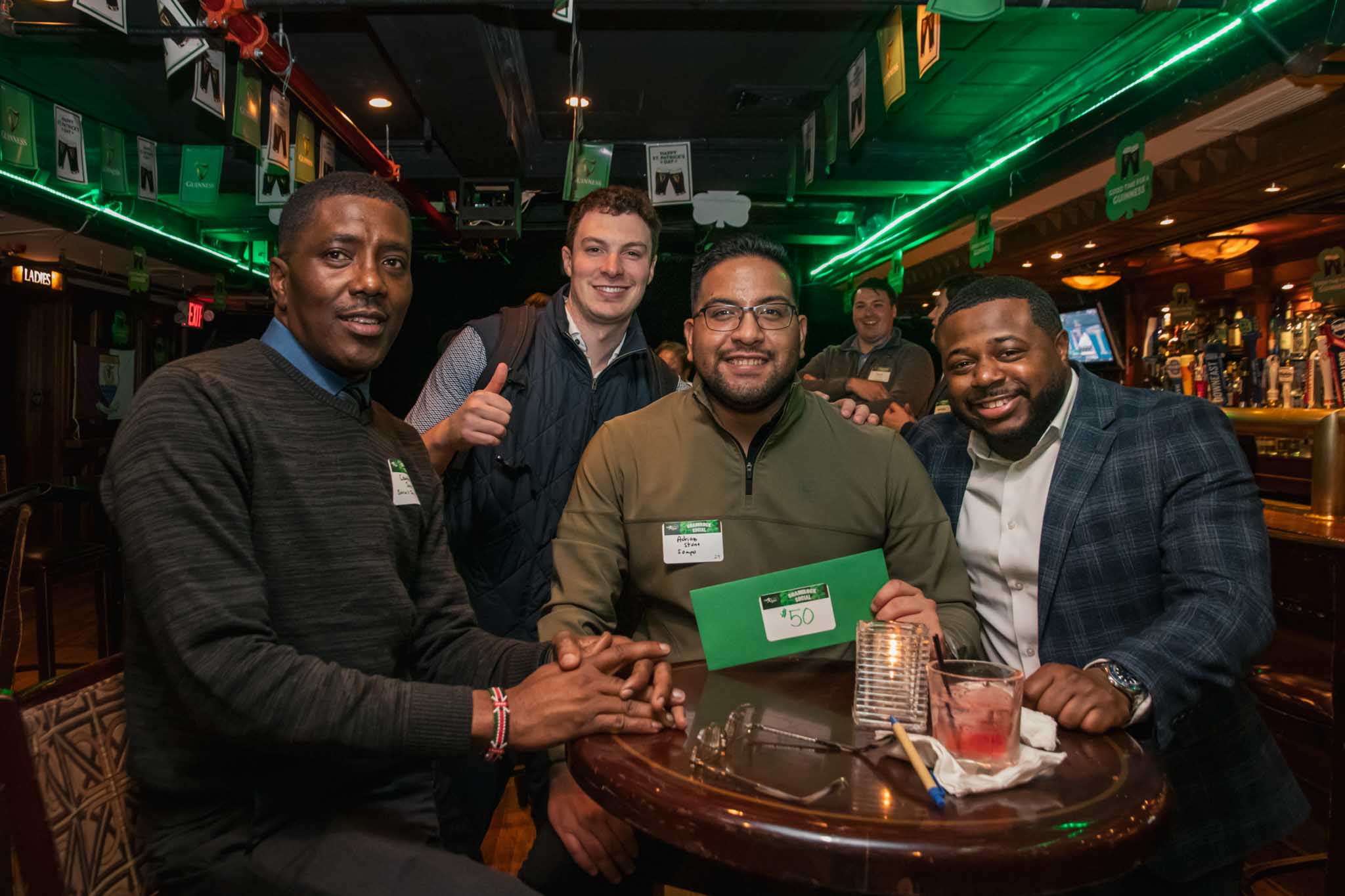 Courtney James (Sarvis Insurance), Adrian Stone (Stompo), and other at the NextGen NYC Shamrock Social.