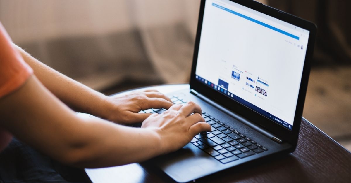 A person working on a laptop.